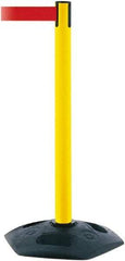 Tensator - 38" High, 2-1/2" Pole Diam, Barricade Tape Dispenser - 14" Base Diam, Round Rubber Base, Yellow Polymer Post, 7-1/2' x 1-7/8" Tape, Single Line Tape, For Outdoor Use - Exact Industrial Supply