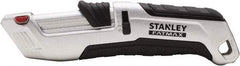 Stanley - Retractable Safety Utility Knife - 2.175" Steel Blade, Silver & Black Ergonomic Non-slip Grips Handle, 4 Blades Included - Exact Industrial Supply
