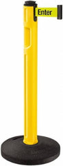 Lavi Industries - 38-1/4" High, 3-1/4" Pole Diam, Stanchion - 16" Base Diam, Dome Recycled Rubber Base, Yellow Plastic Post, 12' x 2" Tape, Single Line Tape, For Outdoor Use - Exact Industrial Supply