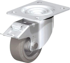 Blickle - 4" Diam x 1-37/64" Wide x 5-7/64" OAH Top Plate Mount Swivel Caster with Brake - Solid Rubber, 440 Lb Capacity, Ball Bearing, 5-1/2 x 4-3/8" Plate - Exact Industrial Supply