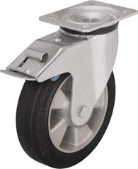 Blickle - 6-1/2" Diam x 1-31/32" Wide x 7-61/64" OAH Top Plate Mount Swivel Caster with Brake - Solid Rubber, 880 Lb Capacity, Ball Bearing, 5-1/2 x 4-3/8" Plate - Exact Industrial Supply